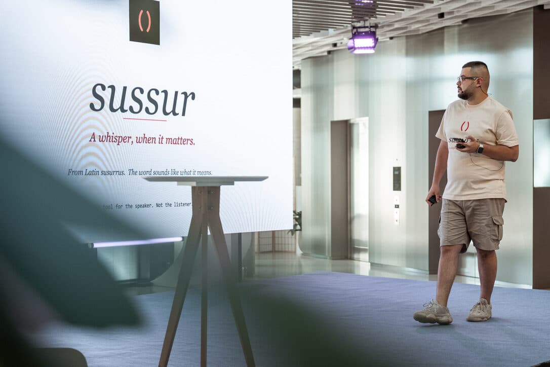The Sussur title slide on stage at the Gluon Conference: a whisper, when it matters